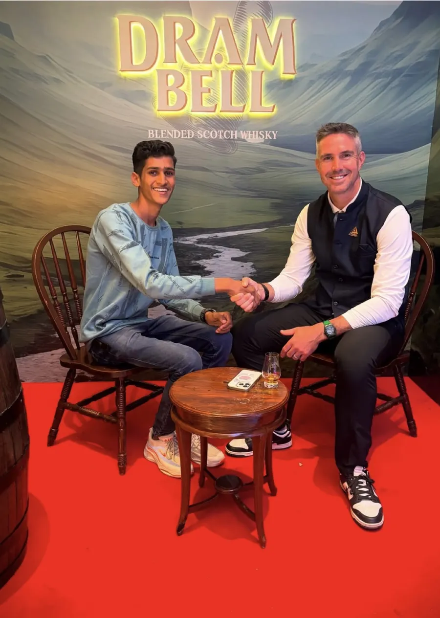 Two guests shaking hands at a Dram Bell Scotch whisky event
